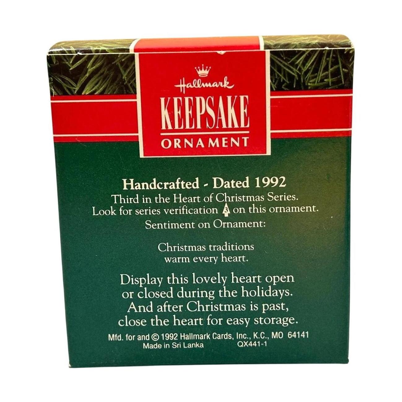 1992 Decorating the Tree Hallmark Ornament (Heart of Christmas) QX4411