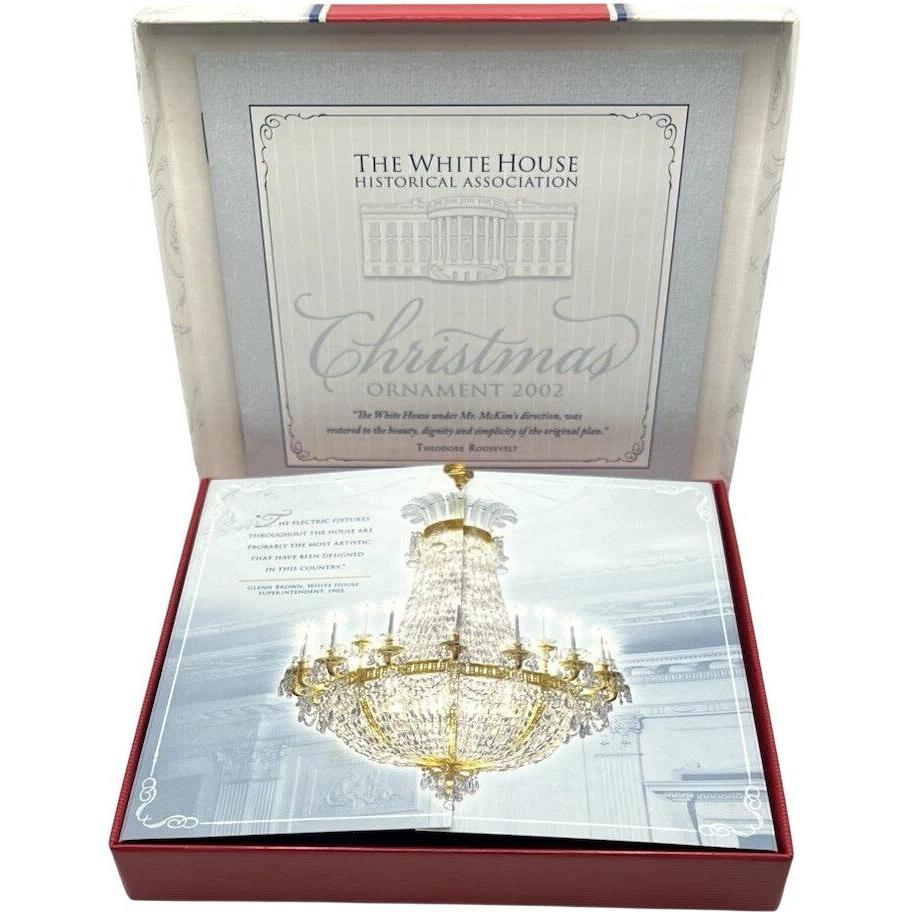 Opulent Gold-Adorned Building with Eagle Motif and Regal Pedestals