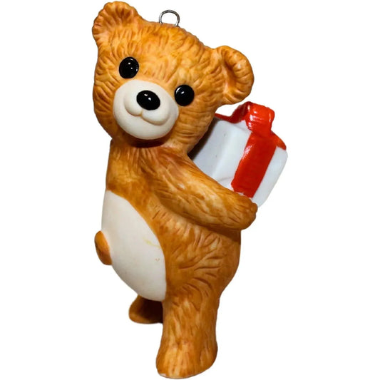 1986 Cinnamon Bear with Gift Hallmark Ornament (Porcelain Bear) QX4056