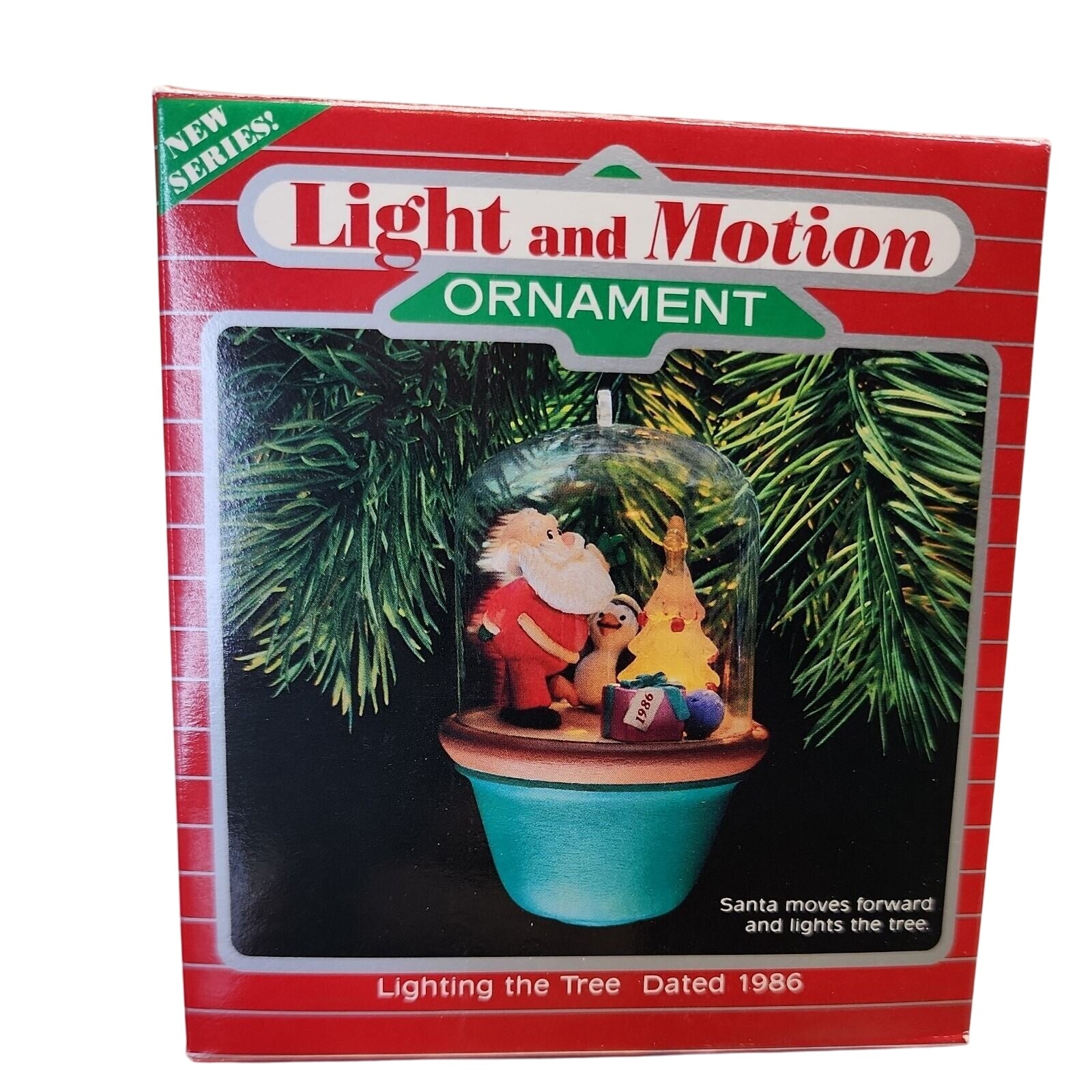 1986 Lighting the Tree Hallmark Ornament (Santa and Sparky) QLX7033