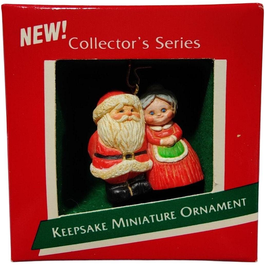 1989 Santa with Package Behind Back Hallmark Ornament (The Kringles) QXM5625