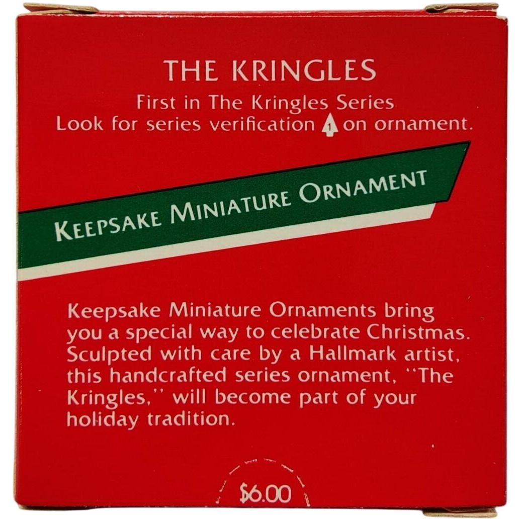 1989 Santa with Package Behind Back Hallmark Ornament (The Kringles) QXM5625