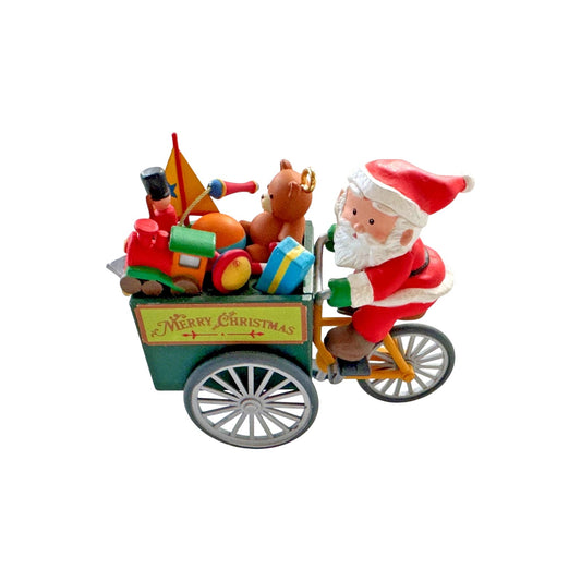 1991 Peddle Pushin' Santa - Third Issue in the "Travelin' Santa" Series (Santa Claus)