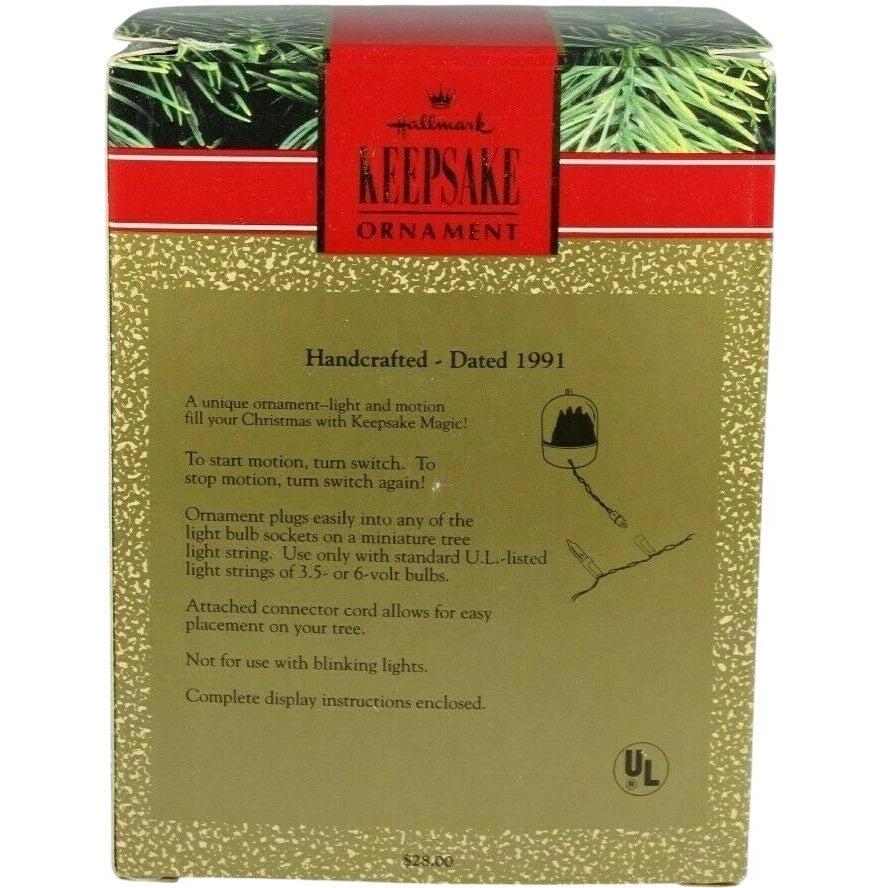 1991 Bringing Home the Tree Hallmark Ornament (Light & Motion) QLX7249