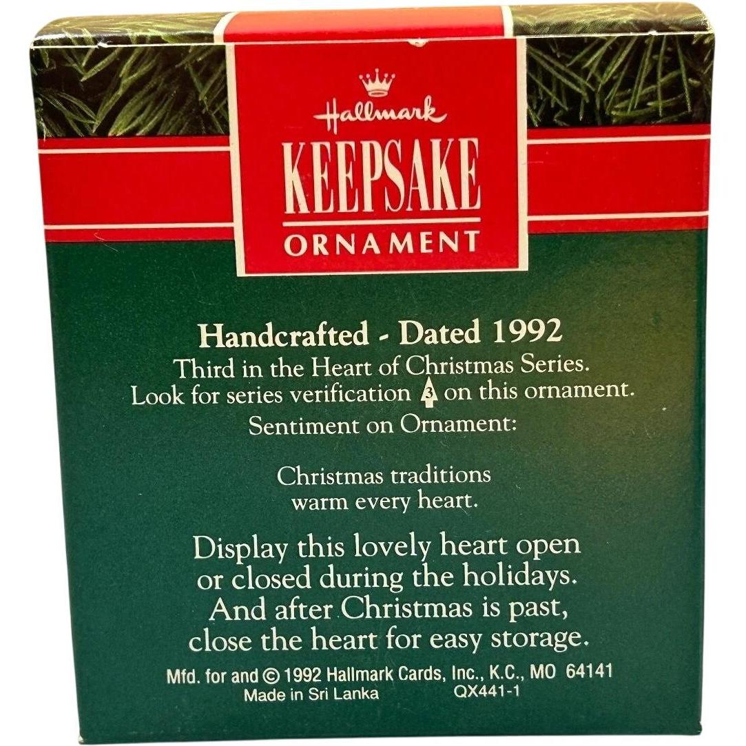 1992 Decorating the Tree Hallmark Ornament (Heart of Christmas) QX4411