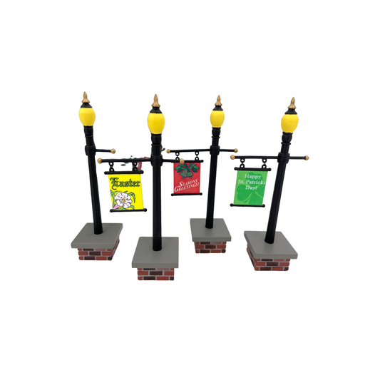 1999 or effectively 2002 “Seasonal Lampposts Set of 4” – Department 56 Village Accessories, Item #56.53048 553048 Image1
