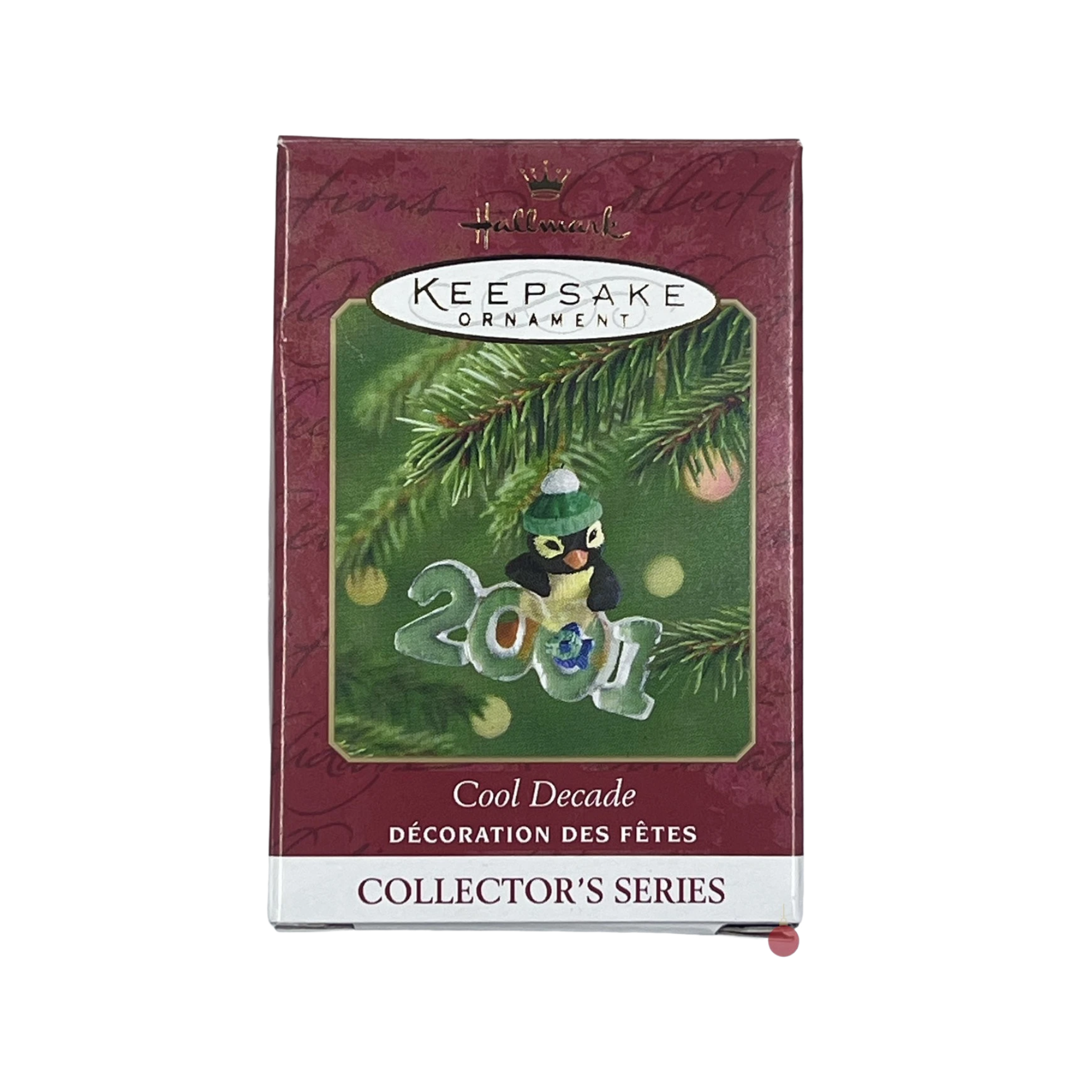 Hallmark Keepsake Ornament packaging with a penguin ornament and '2001' text on a green background.