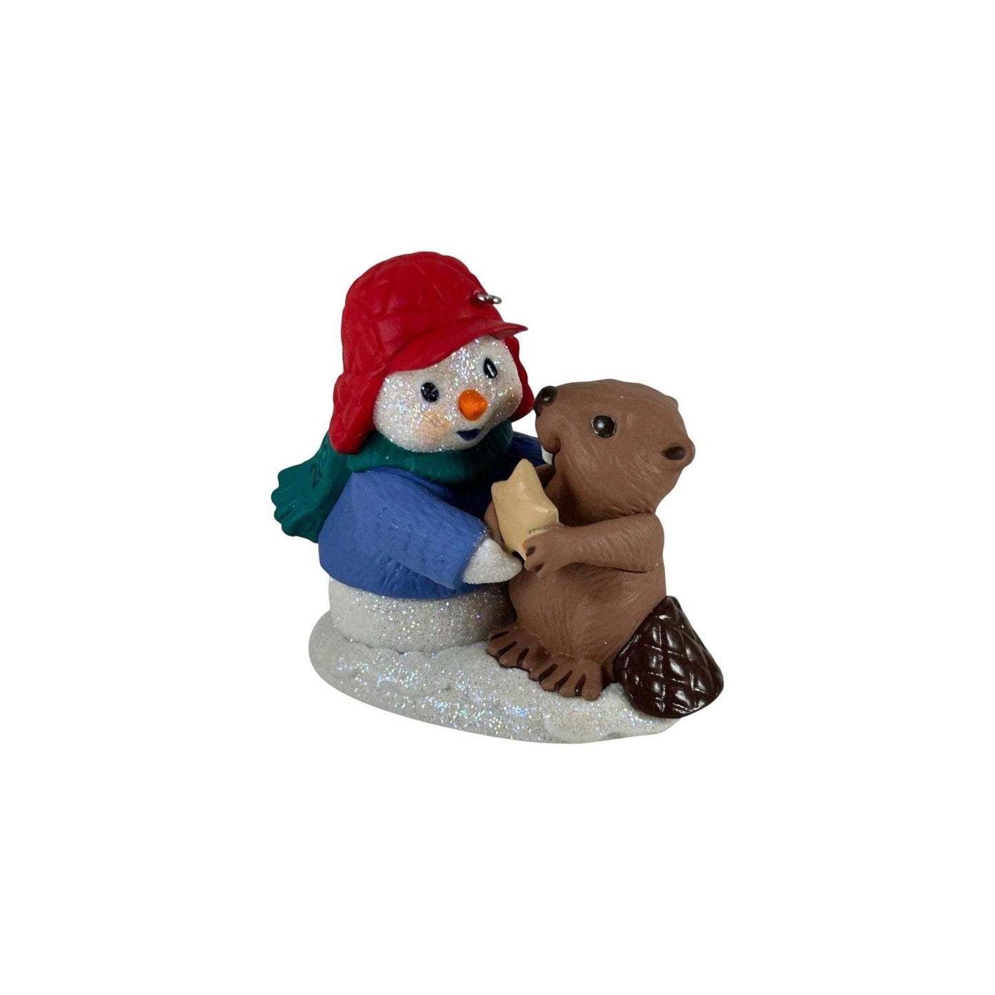 Decorative figurine of a snowman with a red hat and a groundhog on a white background