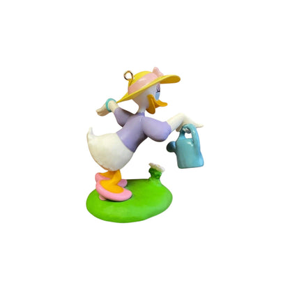 Colorful figurine of a cartoon duck character on a white background