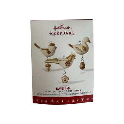 Hallmark Keepsake Christmas ornament set packaging with three bird designs on a white background.