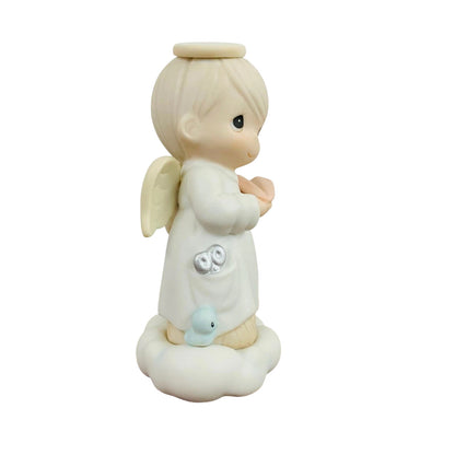 Adorable Child Figurine with Halo Holding Paper Plane - Sparking Joy and Imagination