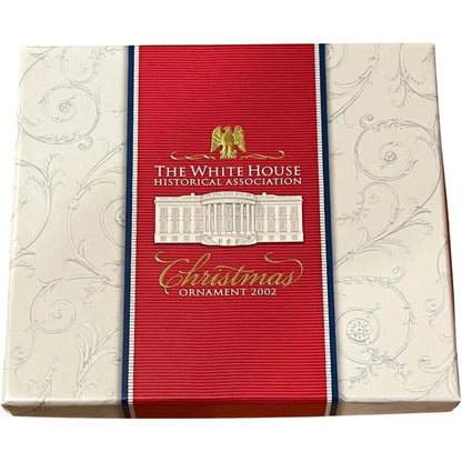 Opulent Gold-Adorned Building with Eagle Motif and Regal Pedestals