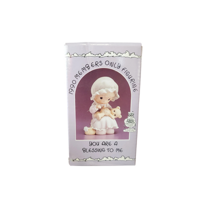 Adorable girl sews patch onto beloved teddy bear Image2