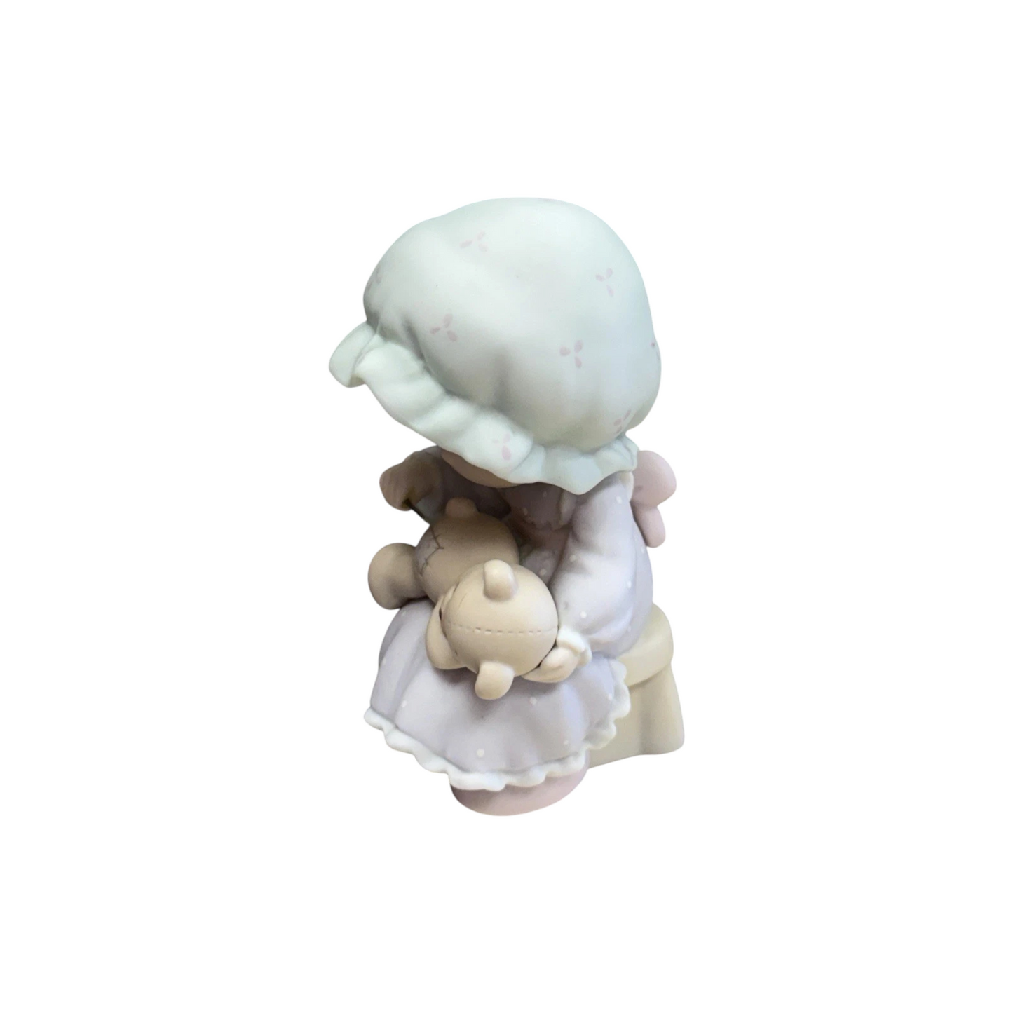 Adorable girl sews patch onto beloved teddy bear Image4