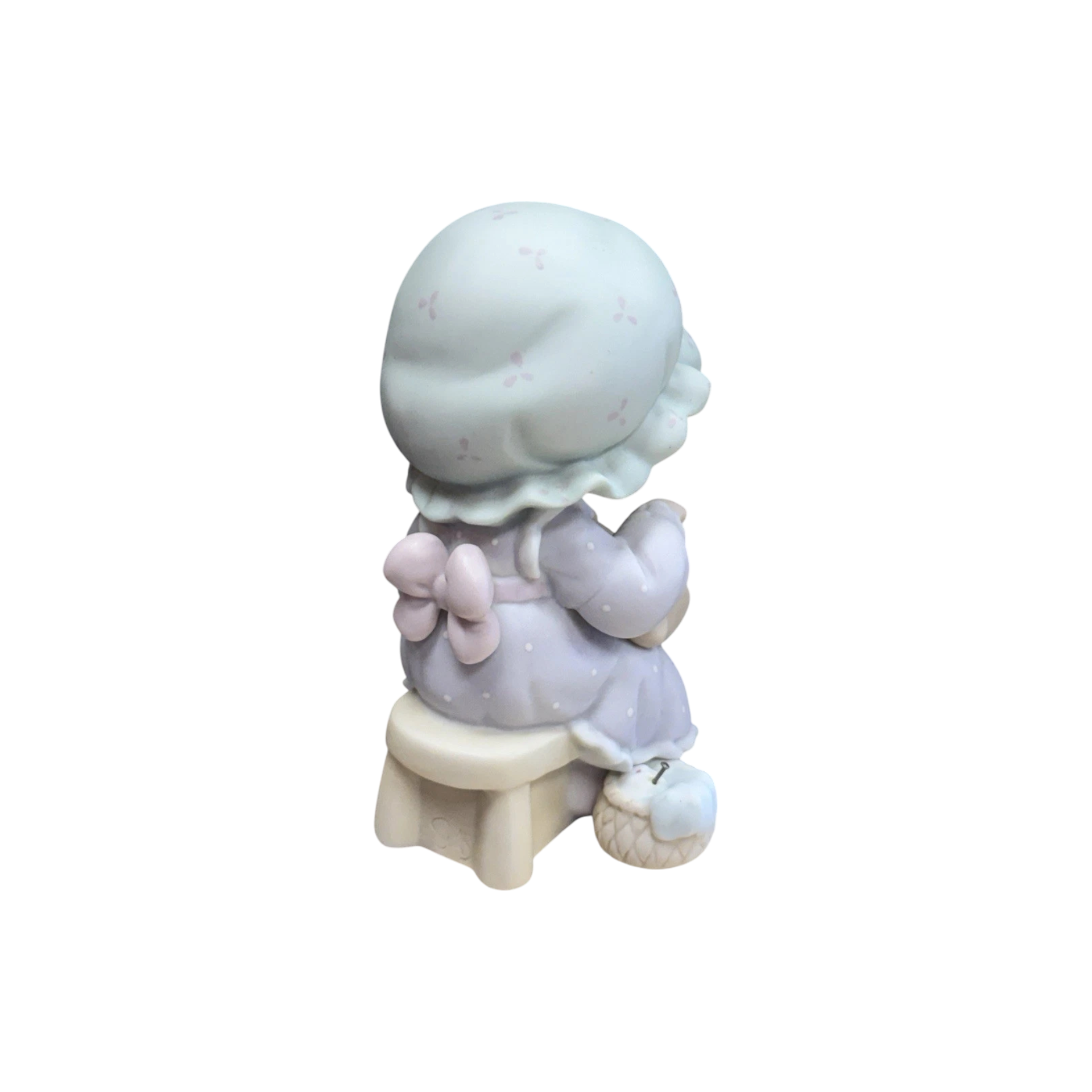 Adorable girl sews patch onto beloved teddy bear Image6