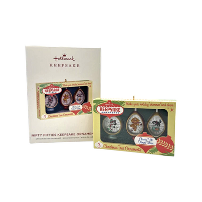 Two packages of Hallmark Keepsake Christmas tree ornaments on a white background
