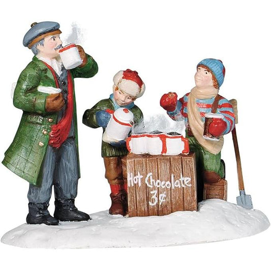 Cheerful vendor spreads holiday joy with hot chocolate on snowy city street Image1