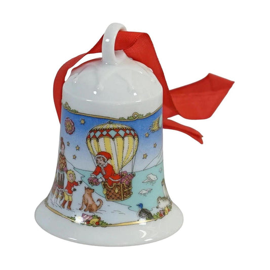 Festive Red and Gold Bells Hanging from Snow-Covered Branches Image1
