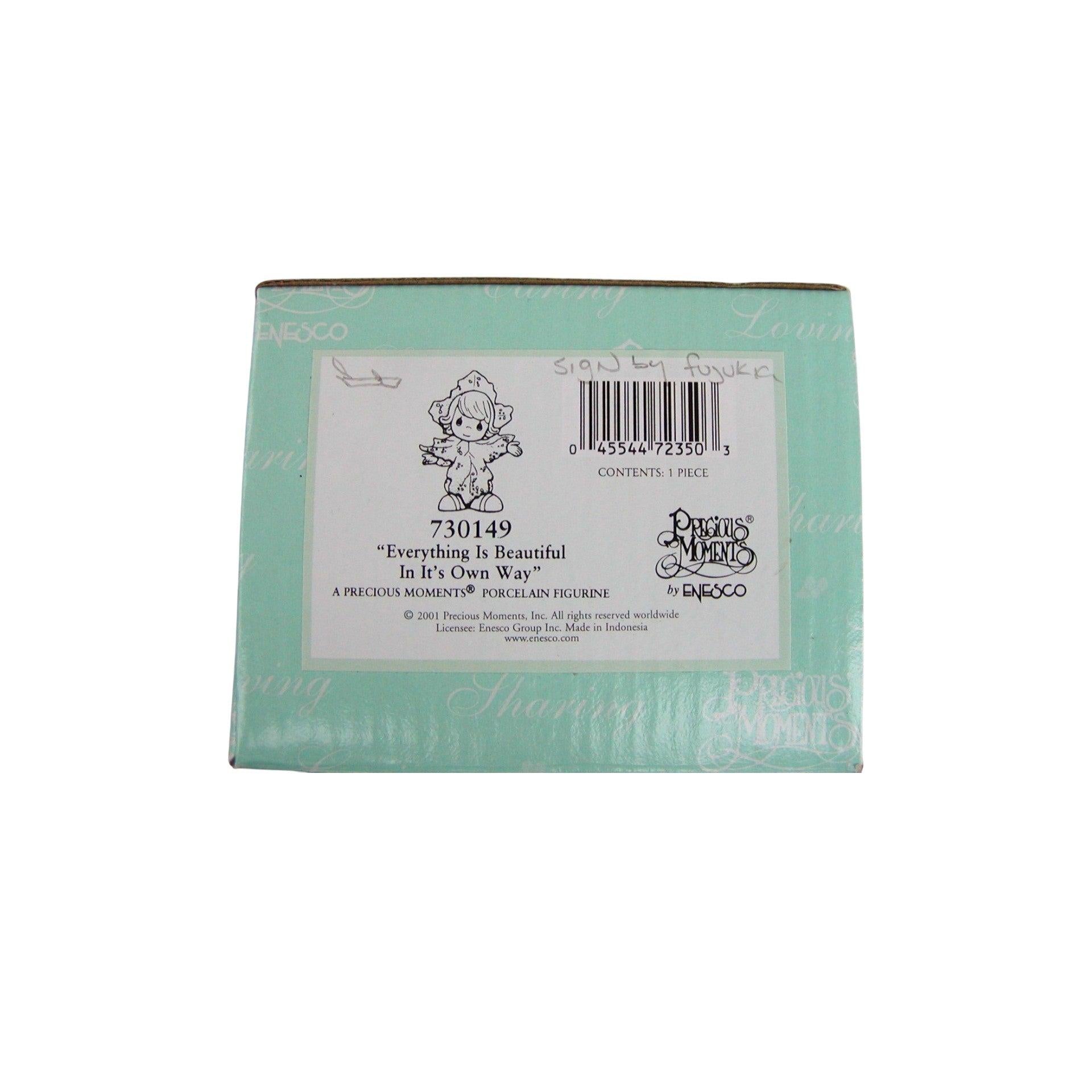 Back of a Porcelain Figurine packaging with branding and product details.