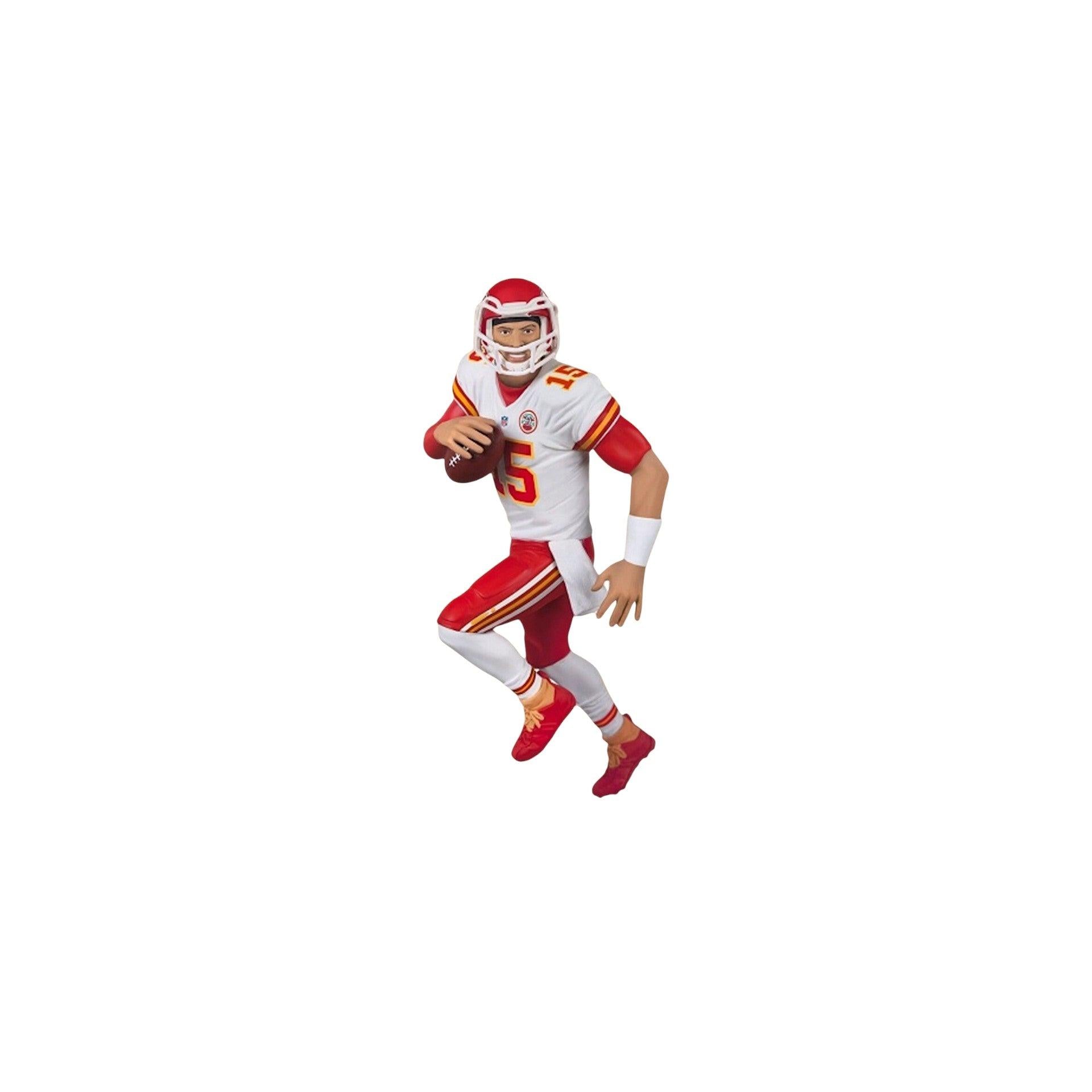 Football player action figure in red and white uniform with helmet and football on a white background