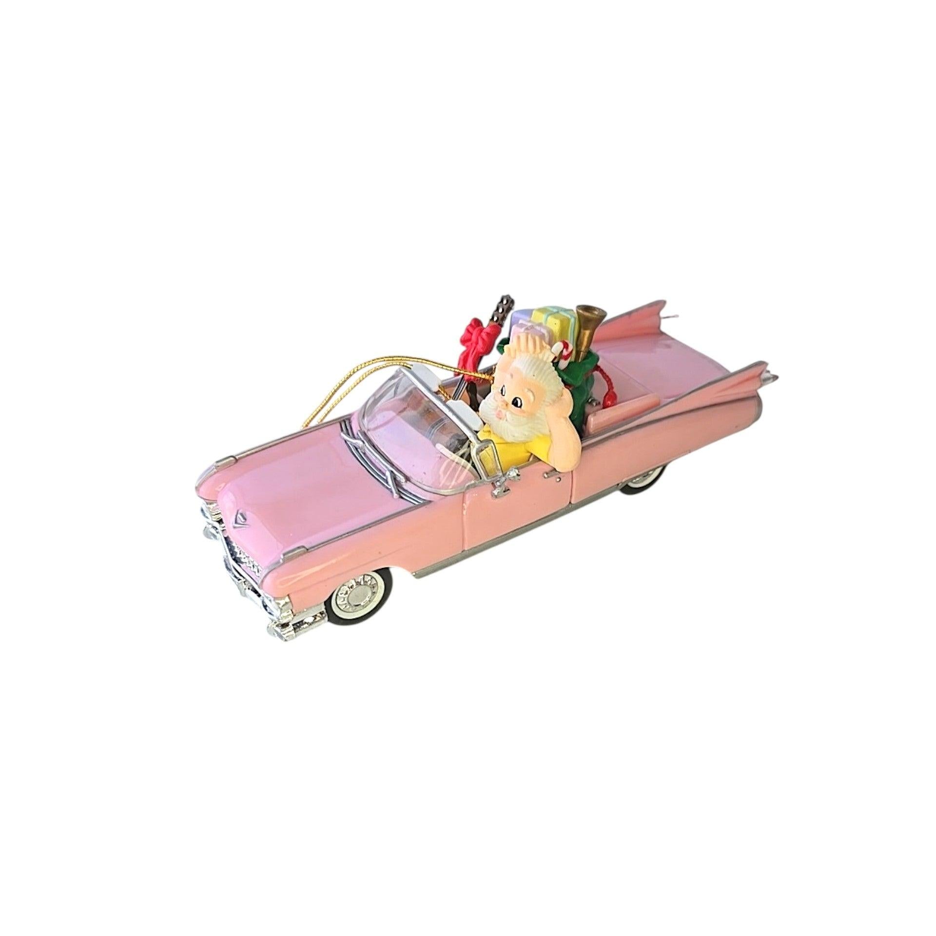 Pink convertible car with a character inside on a white background