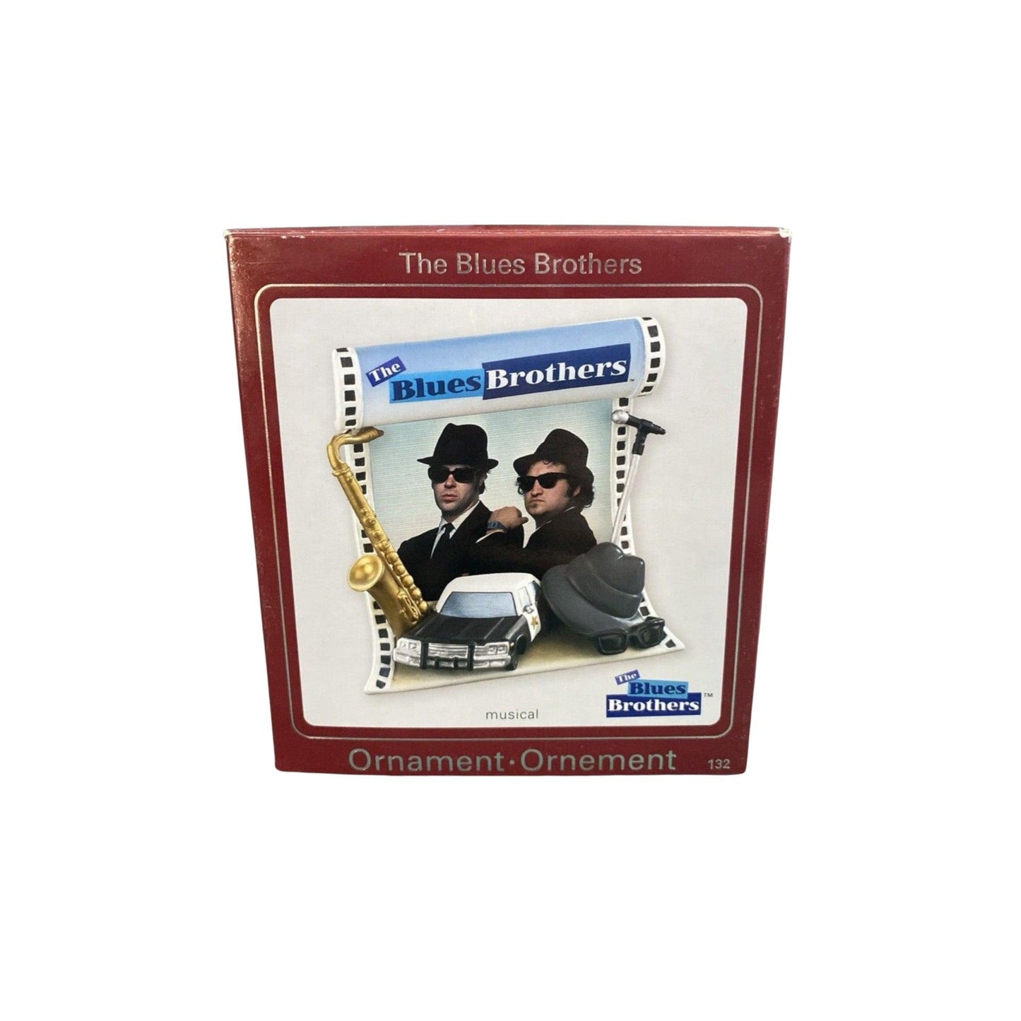 Blues Brothers ornament packaging with two men, saxophone, and car illustration.