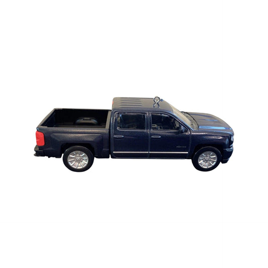 Side view of a blue pickup truck on a white background