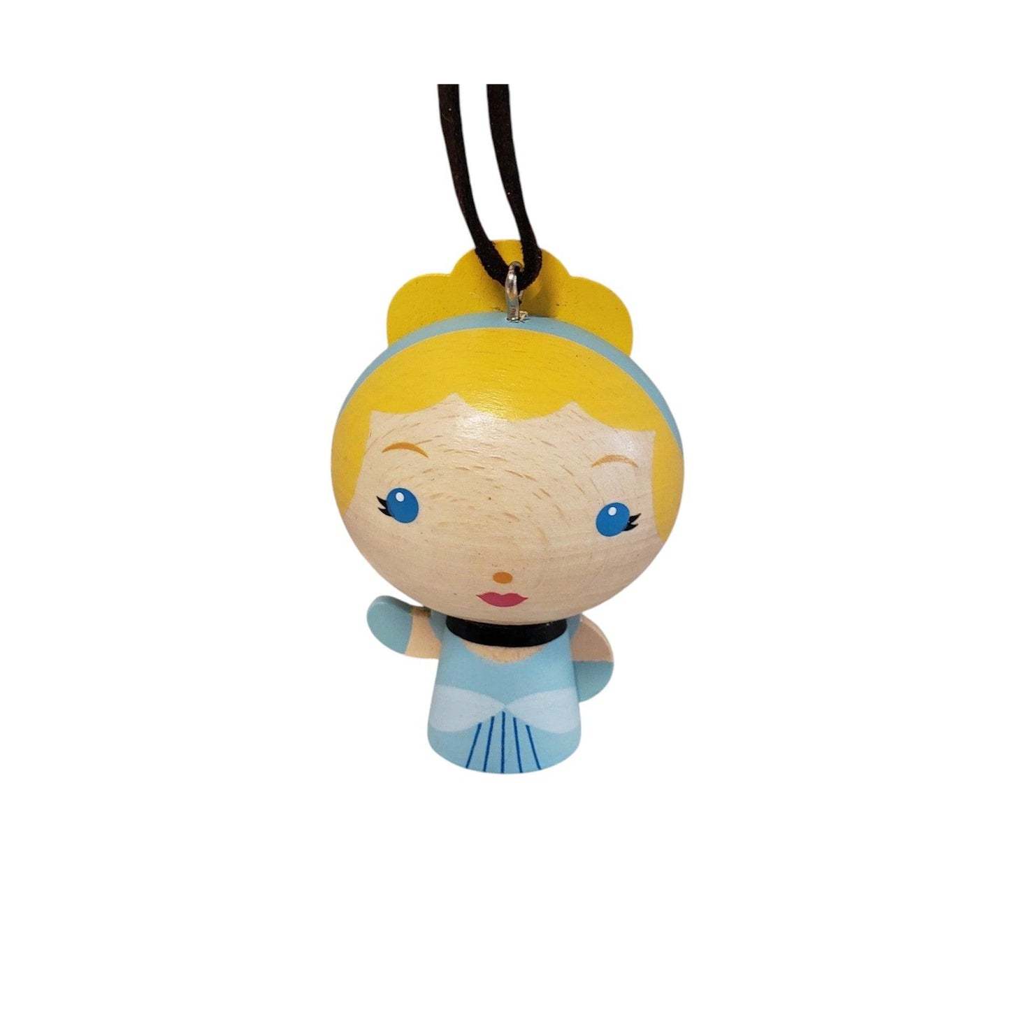 Cute character figurine with yellow hair and blue dress on a white background