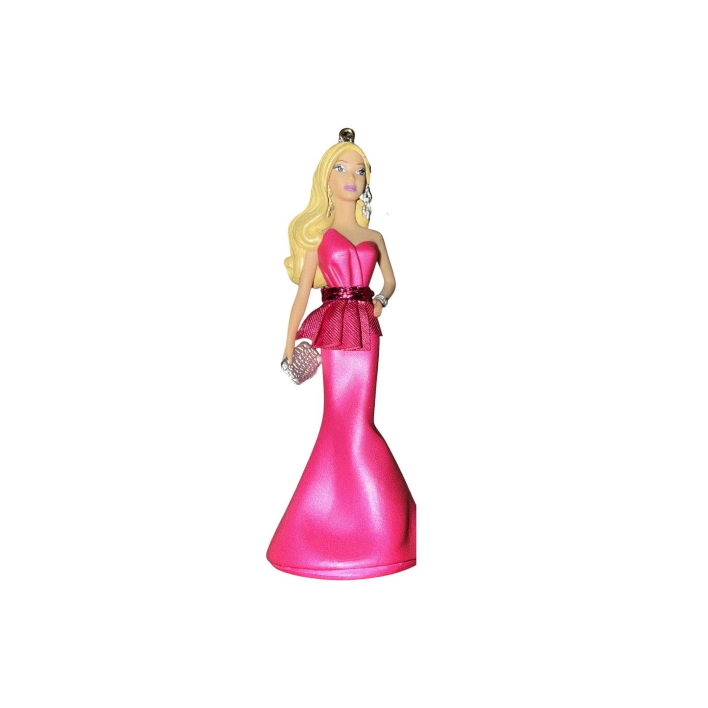 Figurine of a woman in a pink dress with a white background