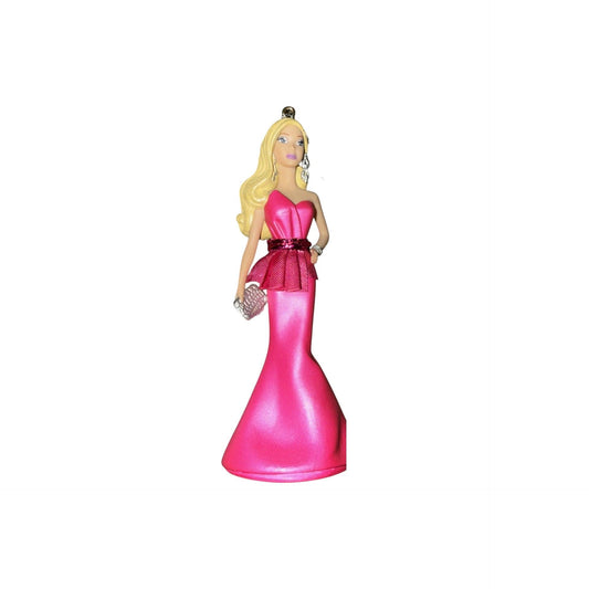 Figurine of a woman in a pink dress with a white background