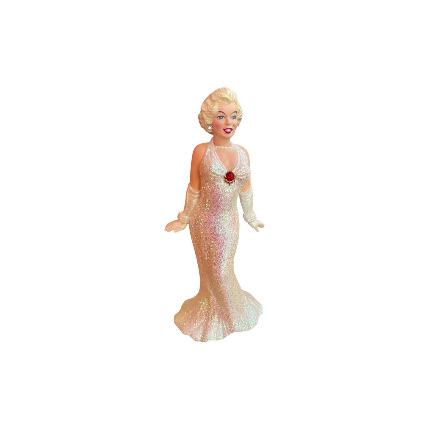Figurine of a woman in a white evening gown with a red flower on a white background