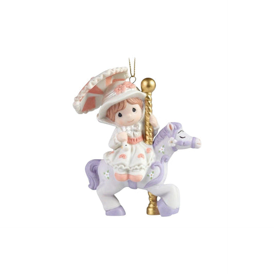 Decorative ornament of a girl riding a unicorn with a pink hat and dress on a white background
