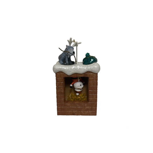 Decorative figurine with a reindeer and snowman on a chimney against a white background