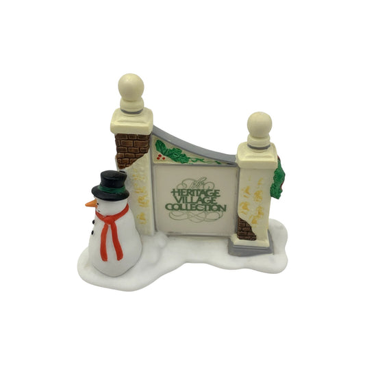 1989 Village Sign with Snowman (Heritage Village Series – Department 56, Item #1341354)