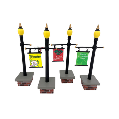 1999 (or effectively 2002) “Seasonal Lampposts (Set of 4)” – Department 56 Village Accessories, Item #56.53048