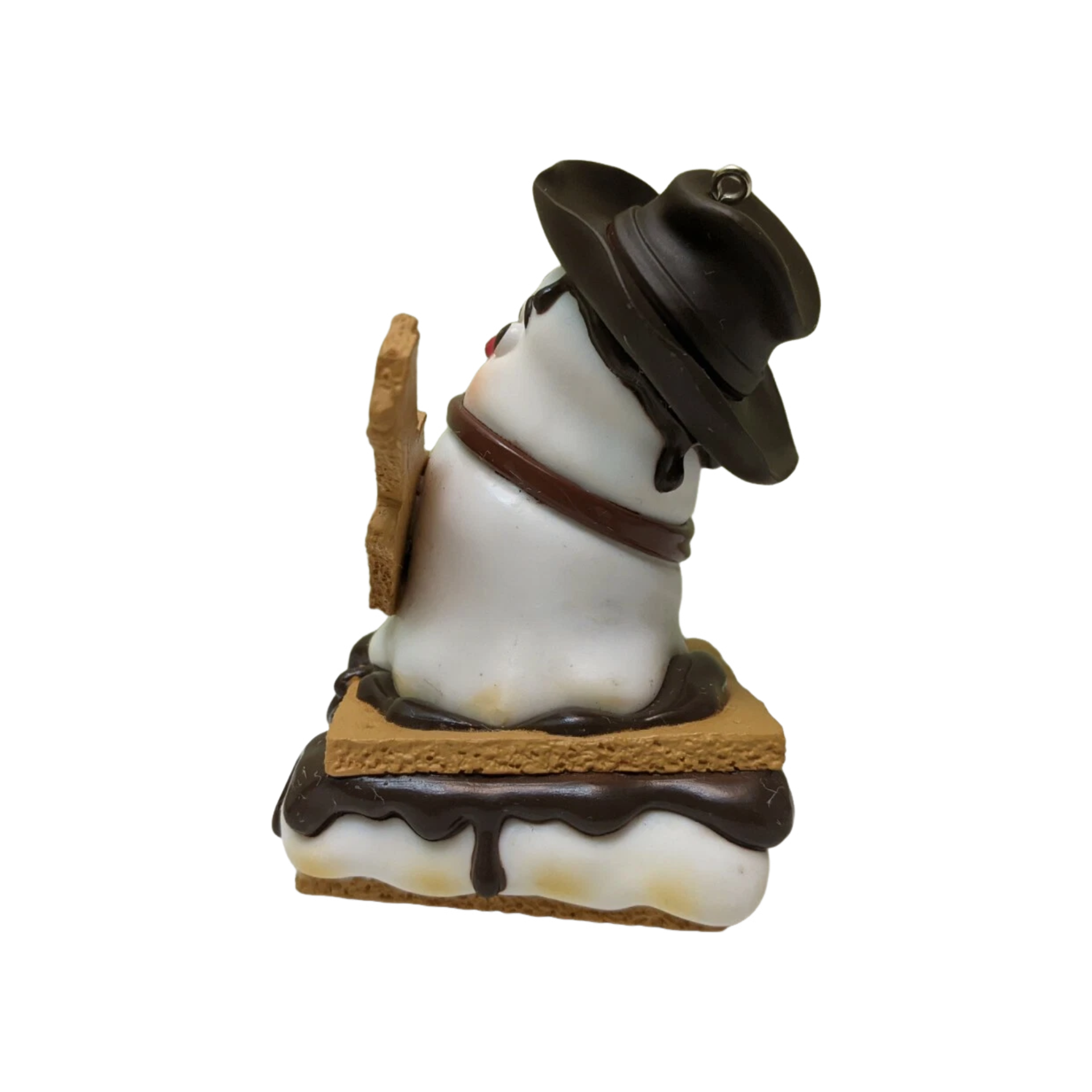 S'mores figurine with a hat and backpack on a white background