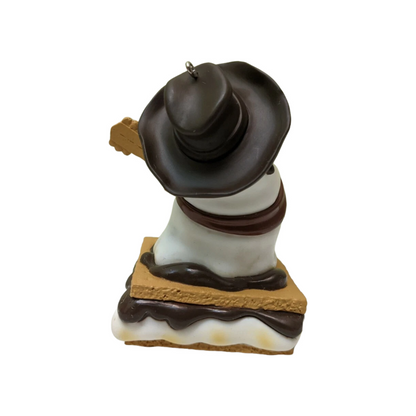 Decorative ornament resembling a s'more with a chocolate bar on top against a white background