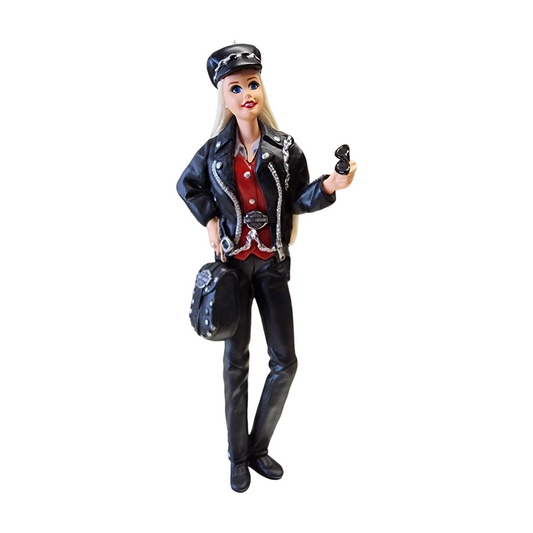 Barbie doll in a motorcycle helmet and leather outfit on a white background