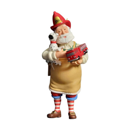 Figurine of a character in firefighter attire holding a dog and a fire truck on a white background