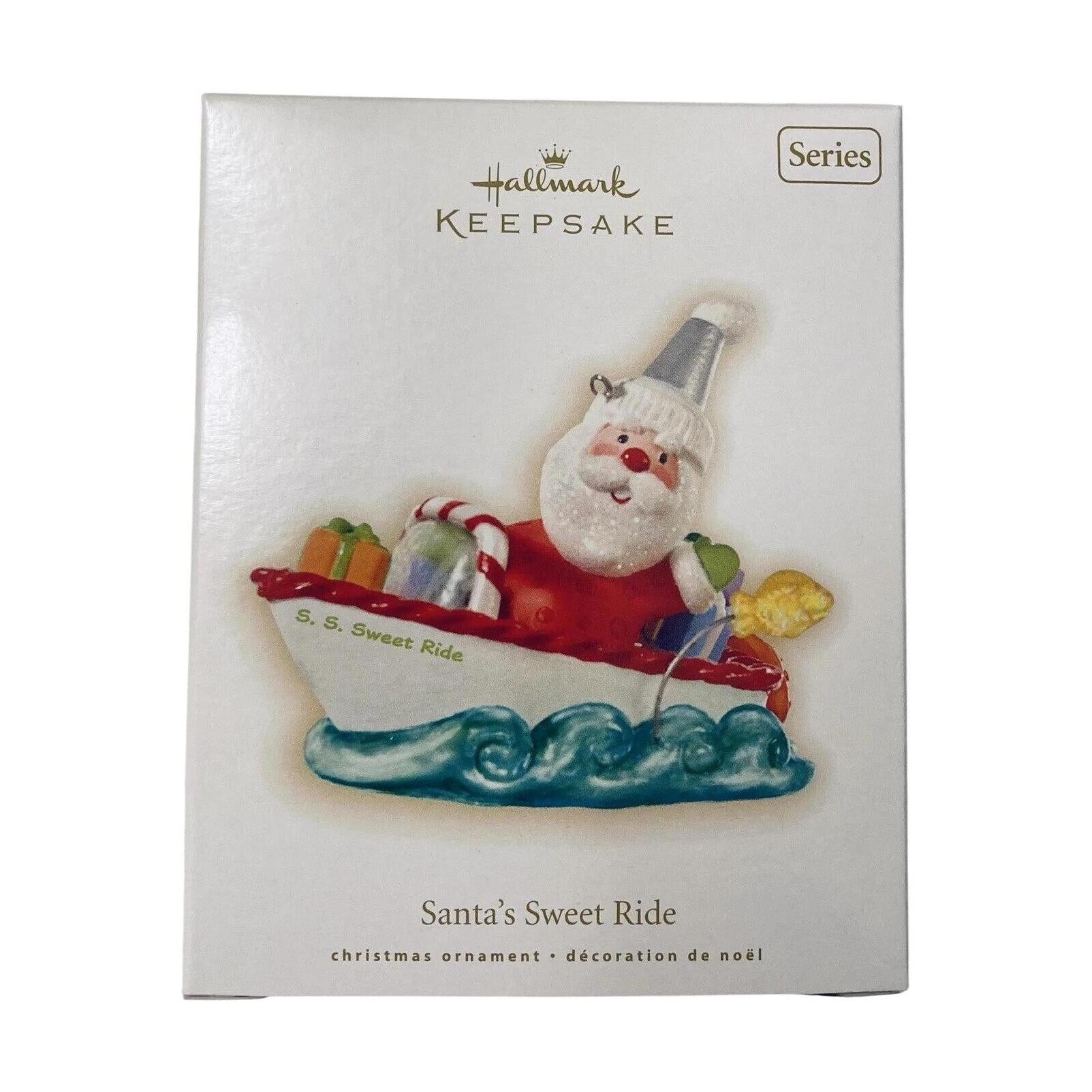 Hallmark Keepsake Christmas ornament packaging with Santa Claus in a boat on a white background