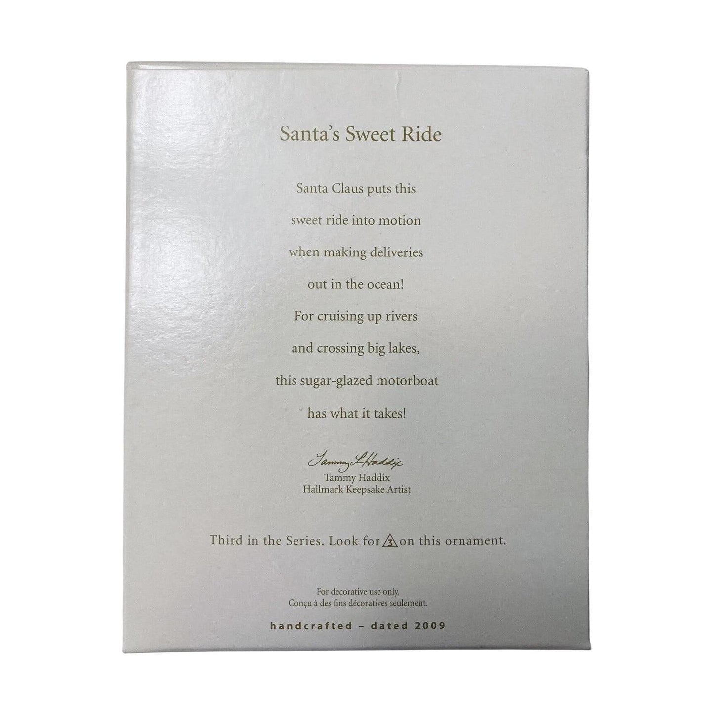 Silver ornament packaging with text about Santa's Sweet Ride on a white background