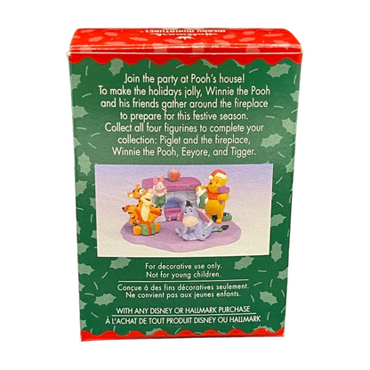 Box for Winnie the Pooh figurines with festive design and text.