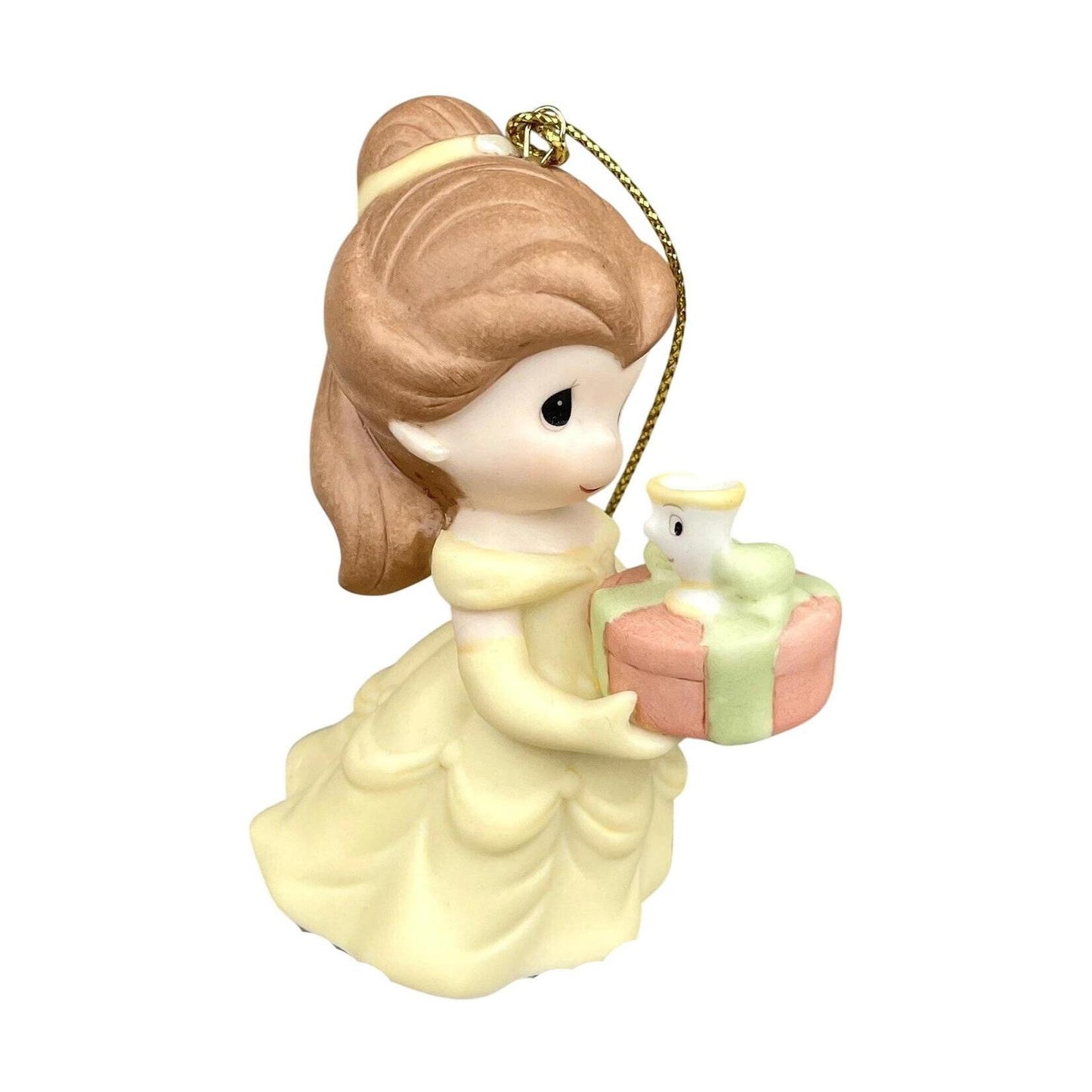 Decorative figurine of a girl holding a gift with a white rabbit on a white background