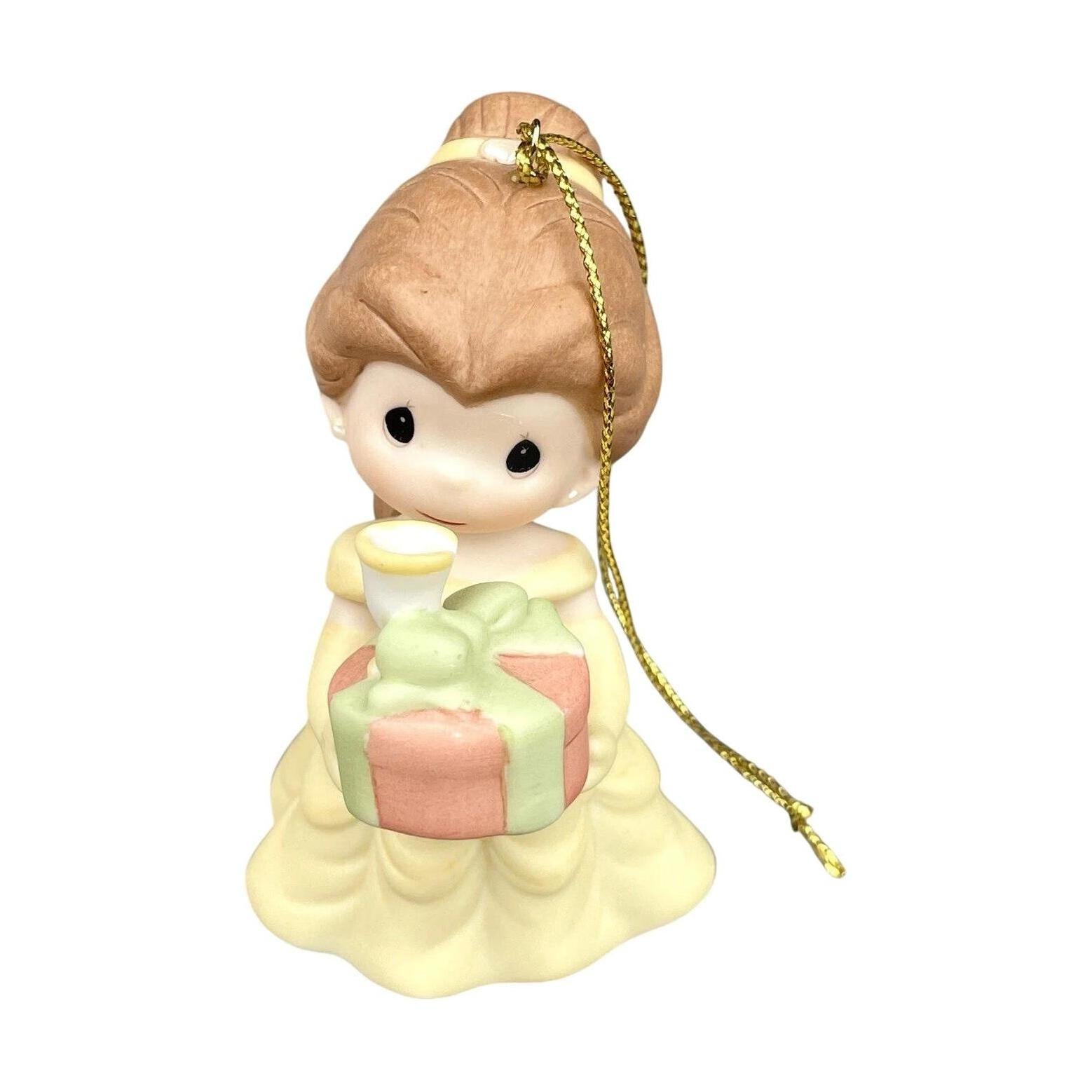 Decorative figurine of a girl holding a gift with a white background