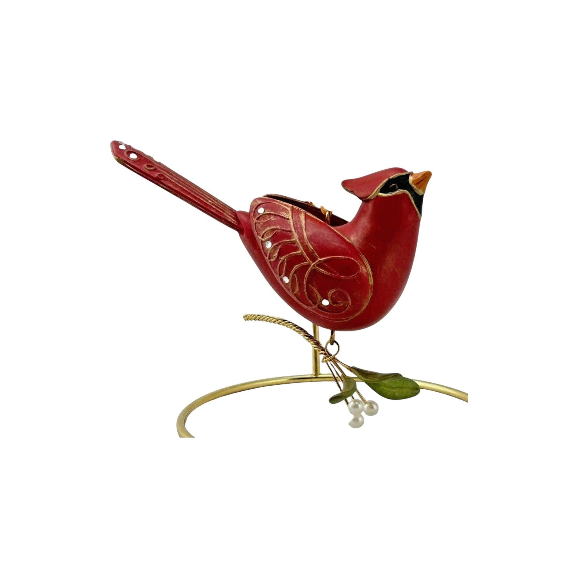 Decorative red bird ornament on a white background